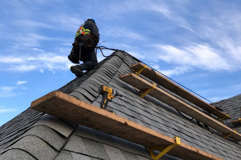 An image of a roof with a skylight and window, highlighting our roofing installation expertise in Reno, NV.