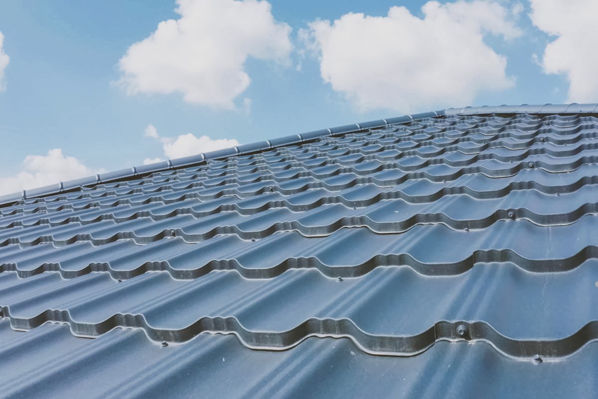 A close-up view of a roof featuring a durable metal roofing system, showcasing the quality of a professional roofing service.
